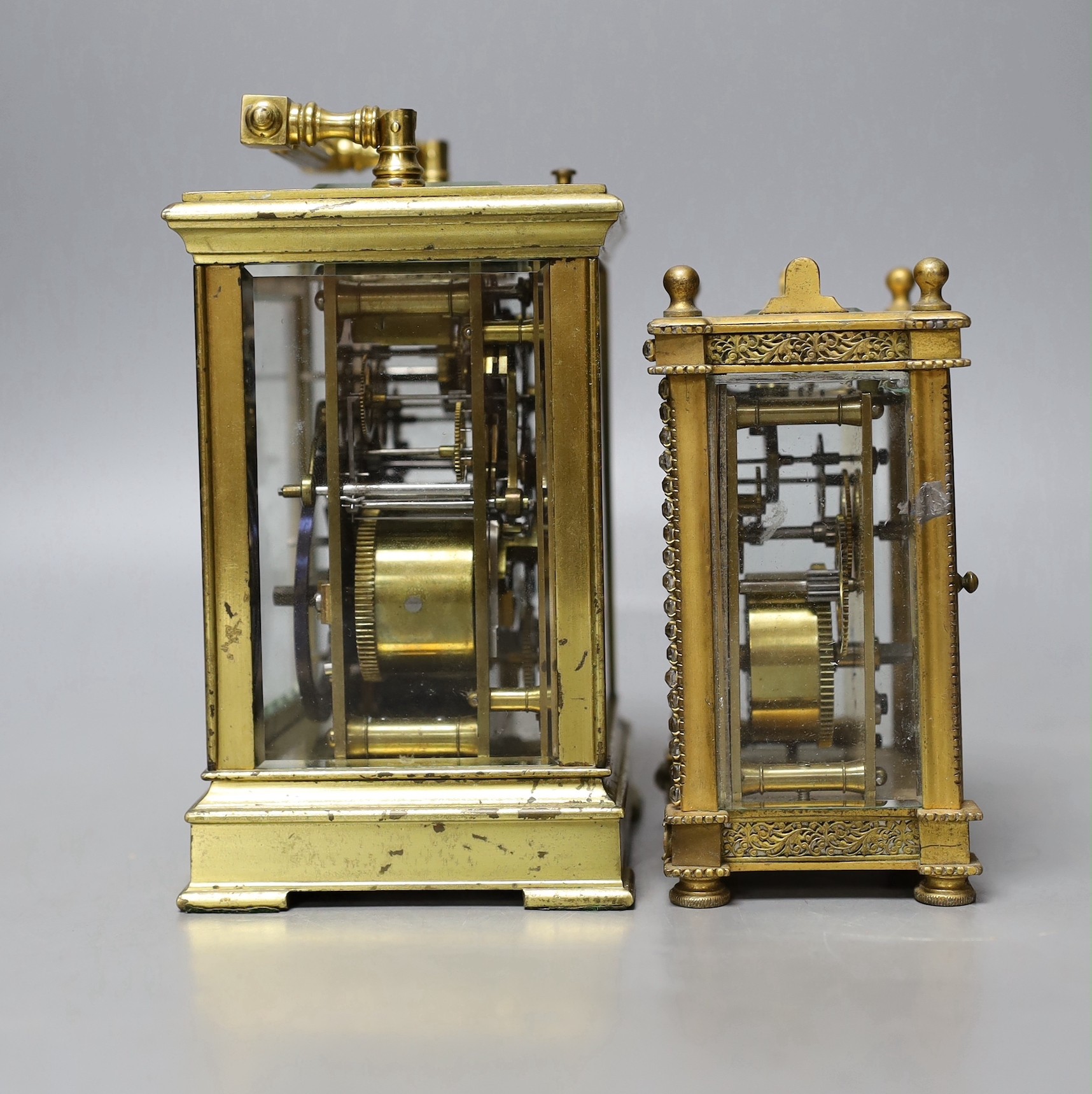 A large French repeating carriage clock with alarm, 16cm. High with handle down and a carriage timepiece